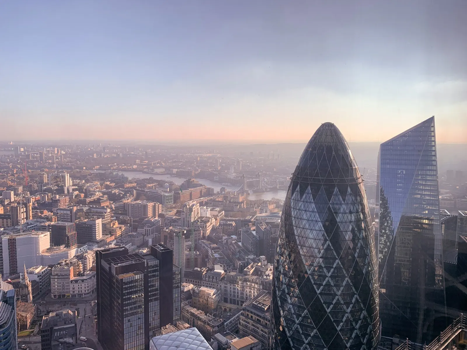 The City of London seen across the Thames in early evening light