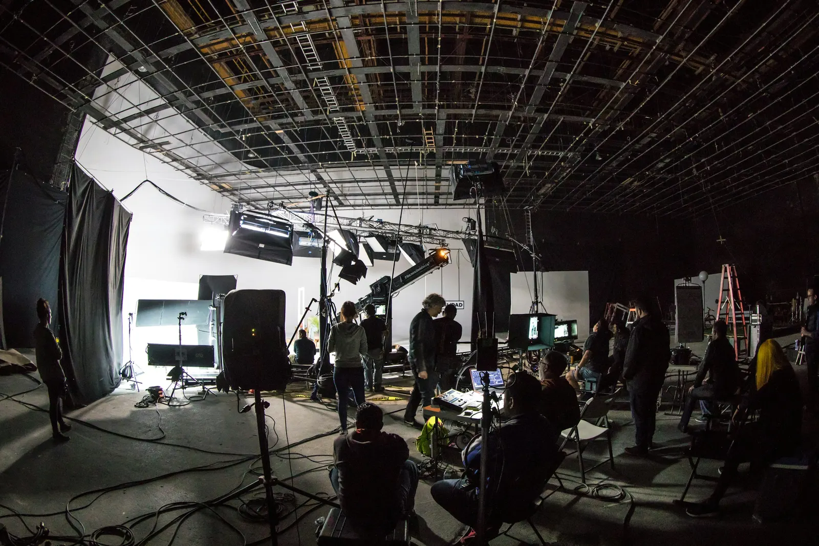 A film set with camera and lighting rigs